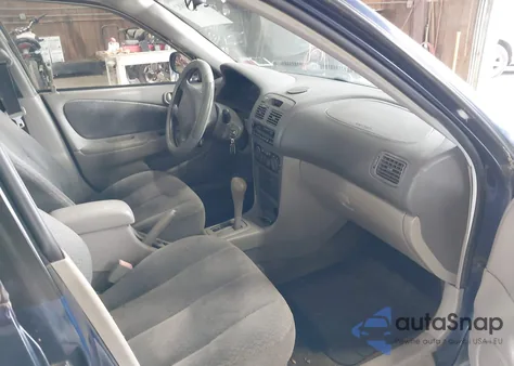 2001 Toyota Corolla Le z USA, uszkodzony, nr VIN 2T1BR12E41C445877